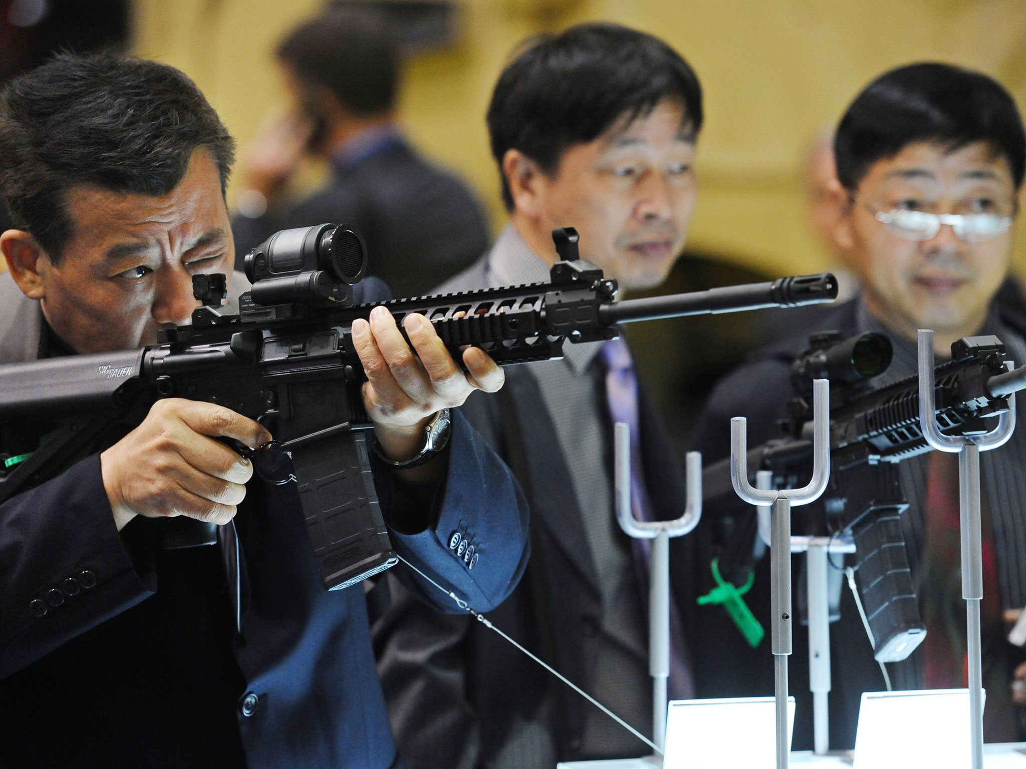 Customers at the Defence and Security Equipment International (DSEI) arms fair in east London