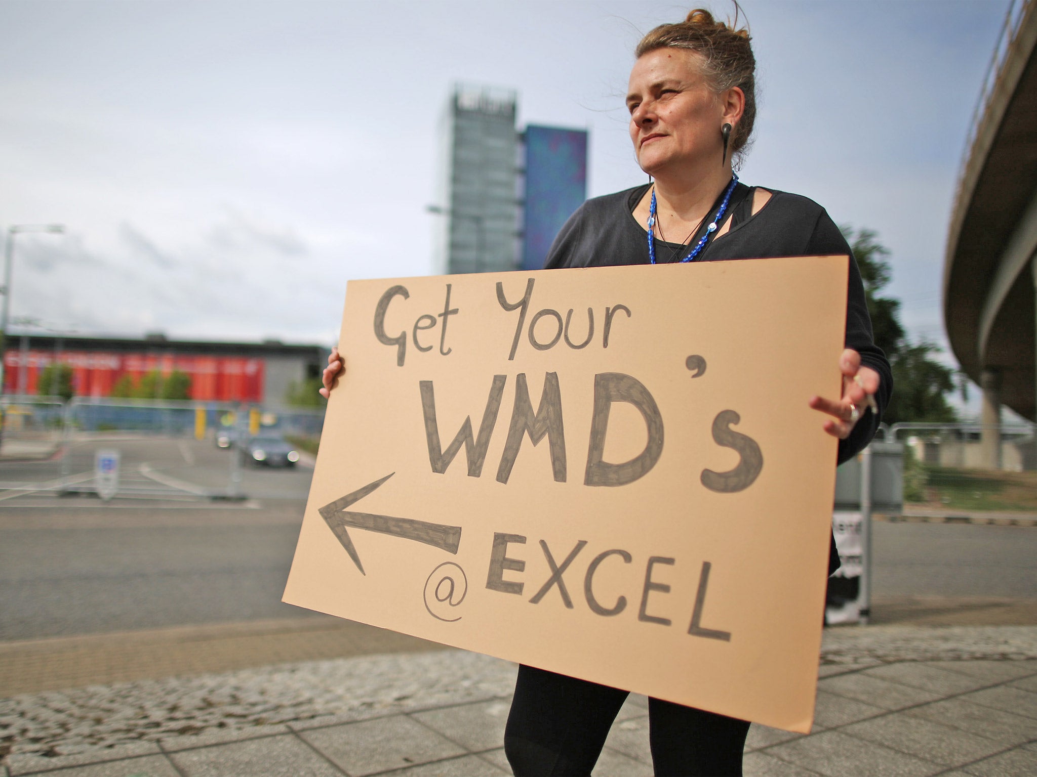 A peace protestor stands outside the ExCel (Getty)