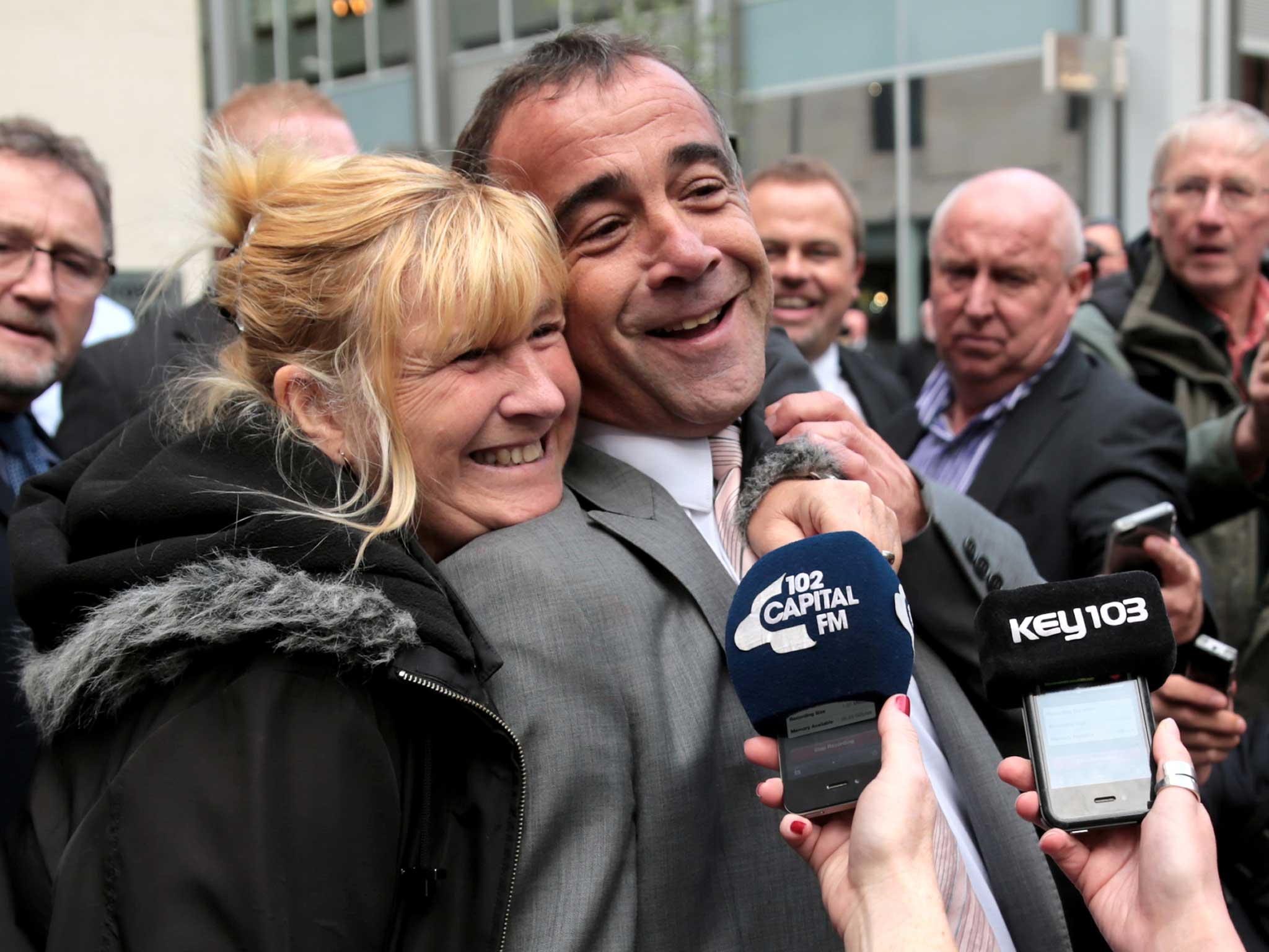 Michael Le Vell is embraced by friends as he makes a statement to the press after being found not guilty