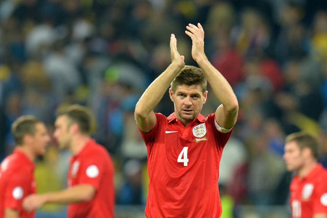 Steven Gerrard applauds the England fans in Kiev