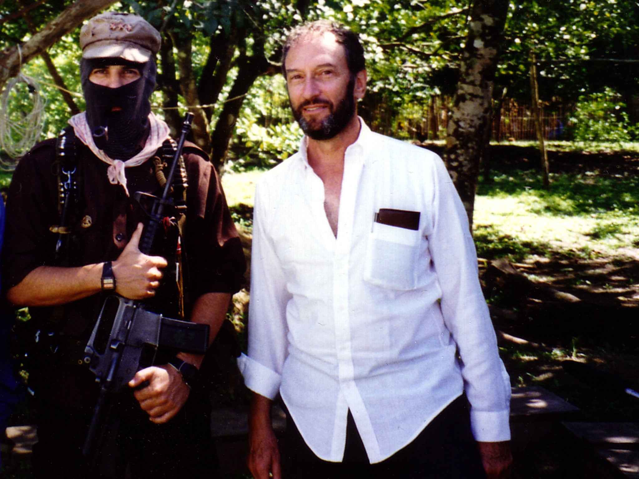 Deceased American filmmaker Saul Landau (r) meets Subcomandante Marcos, the leader of the Zapatista Army of National Liberation in 1995