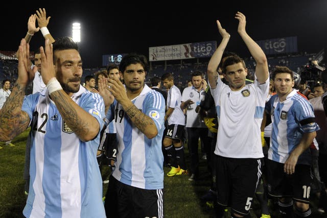 Lionel Messi celebrates World Cup qualification with his team-mates