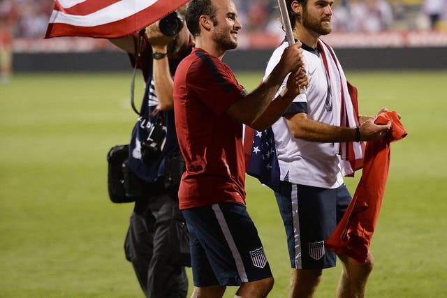 Landon Donovan celebrates after the US qualify for the World Cup