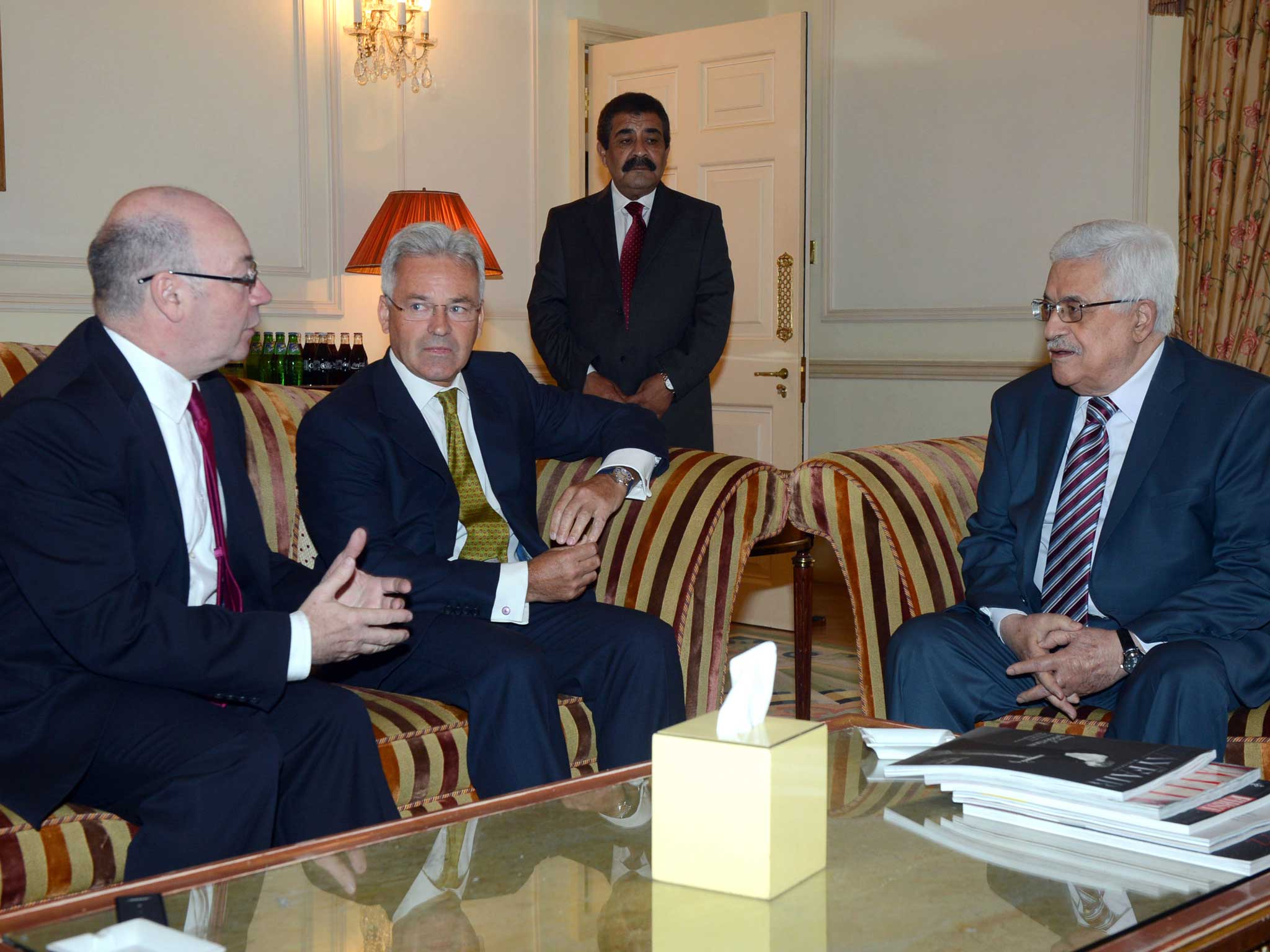 Mahmoud Abbas attends a meeting with British Parliamentary Under Secretary of State for Foreign Affairs Alistair Burt (left) and Minister of State for International Development Alan Duncan