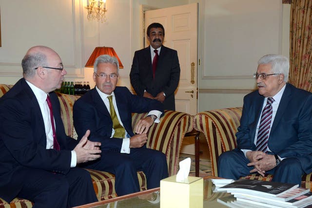 Mahmoud Abbas attends a meeting with British Parliamentary Under Secretary of State for Foreign Affairs Alistair Burt (left) and Minister of State for International Development Alan Duncan