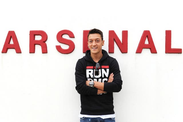 Mesut Ozil poses outside Arsenal's training ground