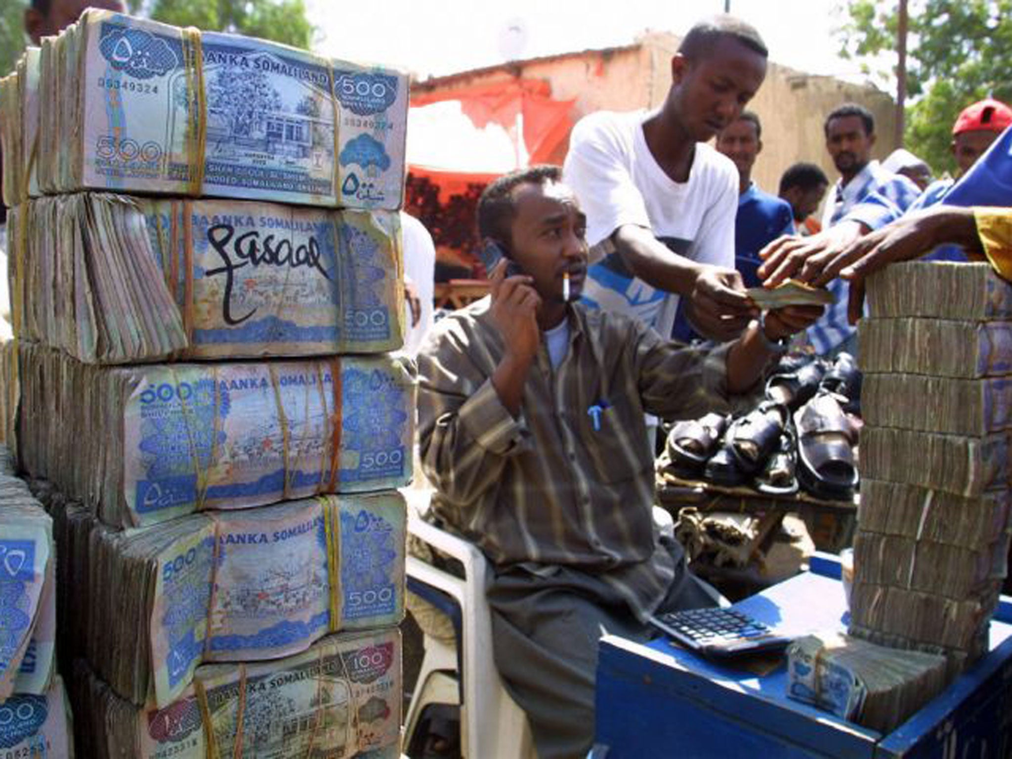 A money exchanger (not Abdulrahim Elmi) doing his business in the busy streets of the Hargeisa market, the capital of the breakaway republic of Somaliland.