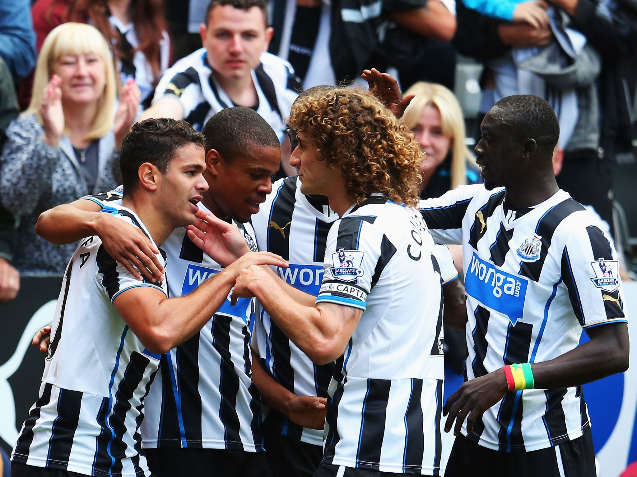 Newcastle United players celebrate scoring against Cardiff City