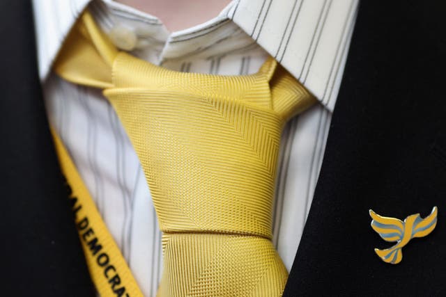 A party member wears a Liberal Democrat badge during the Liberal Democrat Autumn Conference on September 18, 2011 in Birmingham, England.