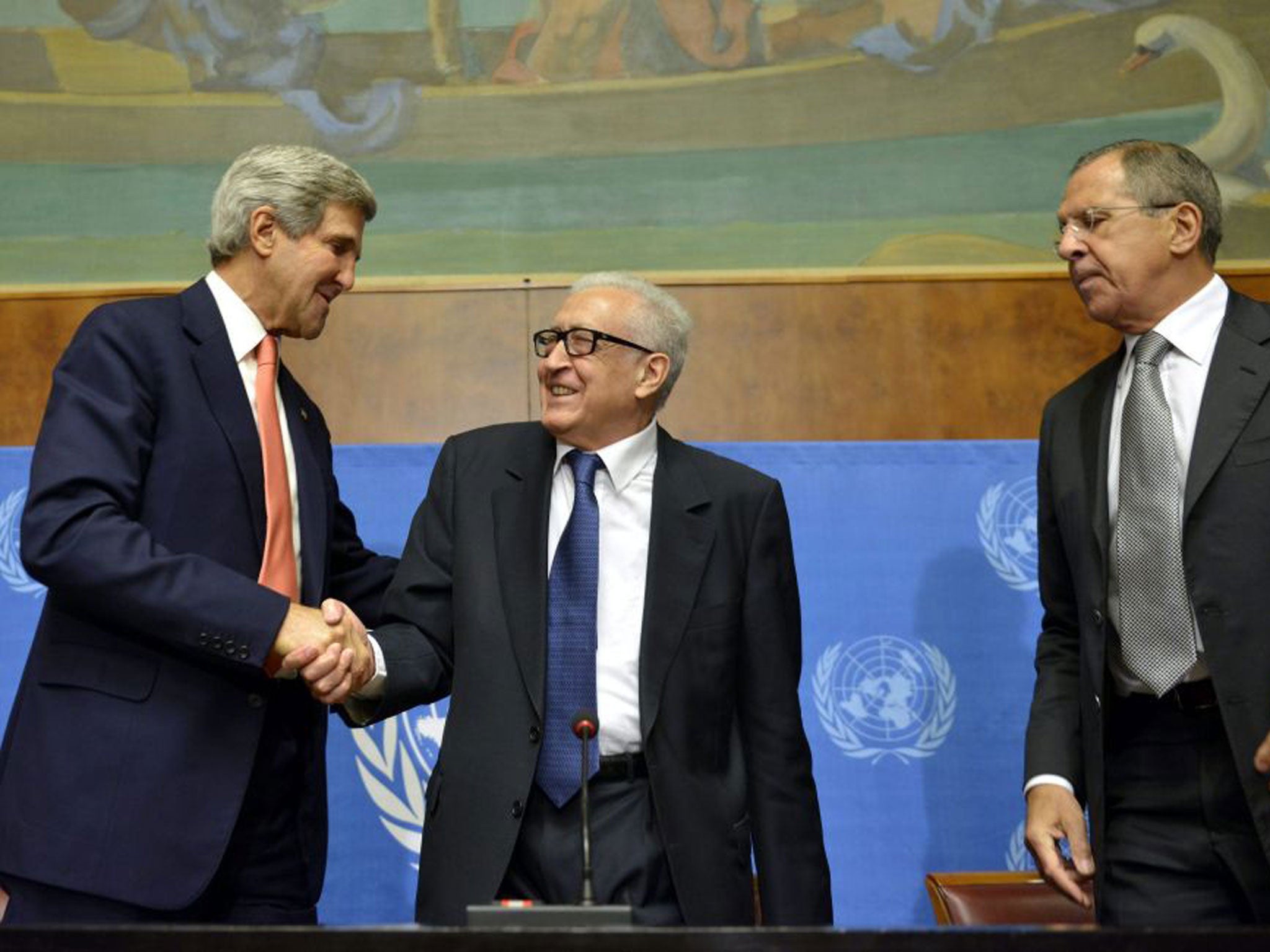 John Kerry shakes hands with Lakhdar Brahimi