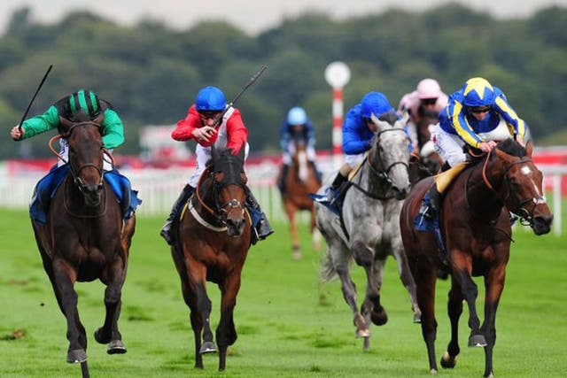 Times Up, left, ridden by Ryan Moore, wins the Speedy Services Doncaster Cup, at Doncaster yesterday