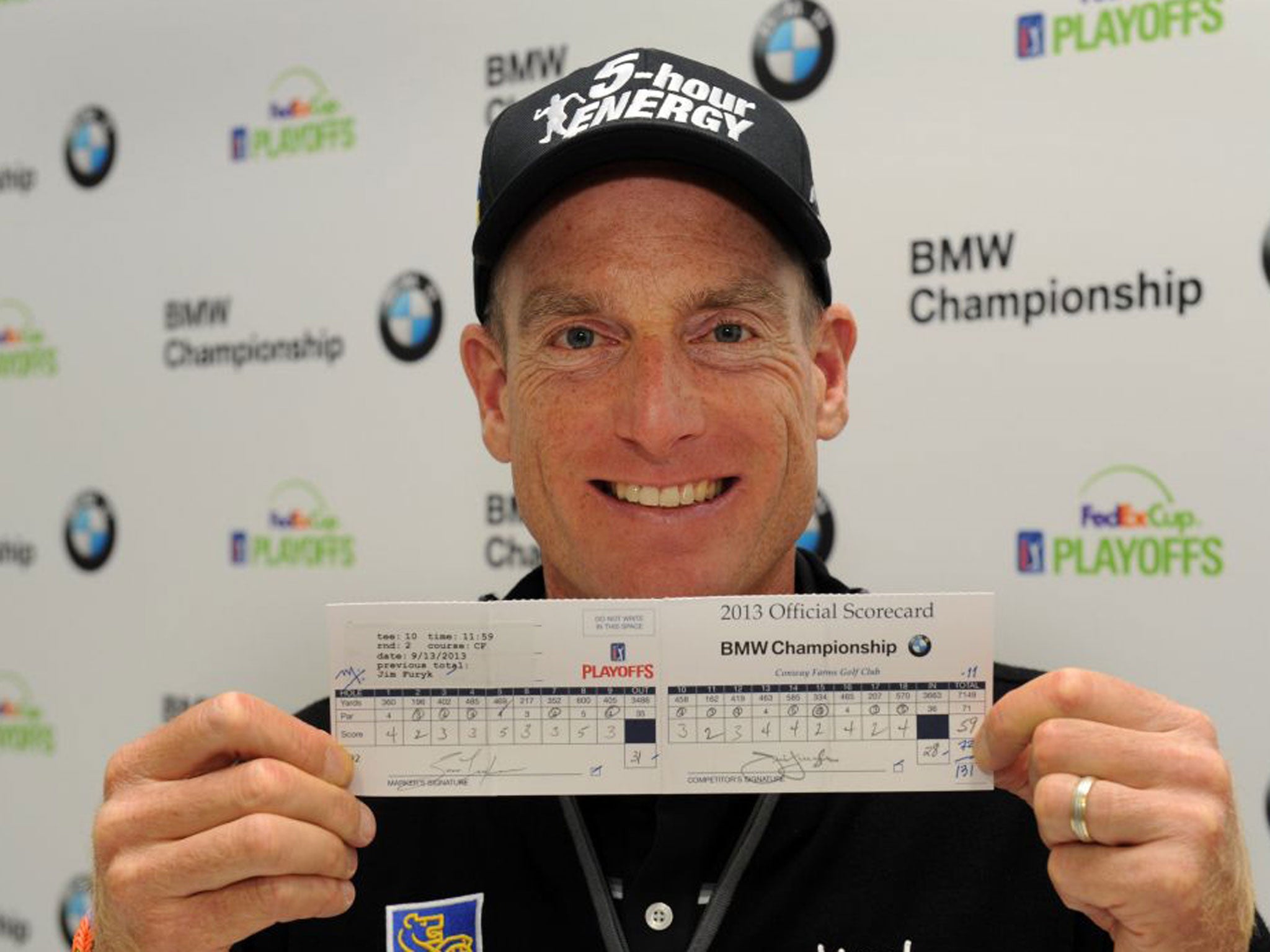 Jim Furyk poses with his score card which recorded a "59" during his second round of the BMW Championship at Conway Farms Golf Club