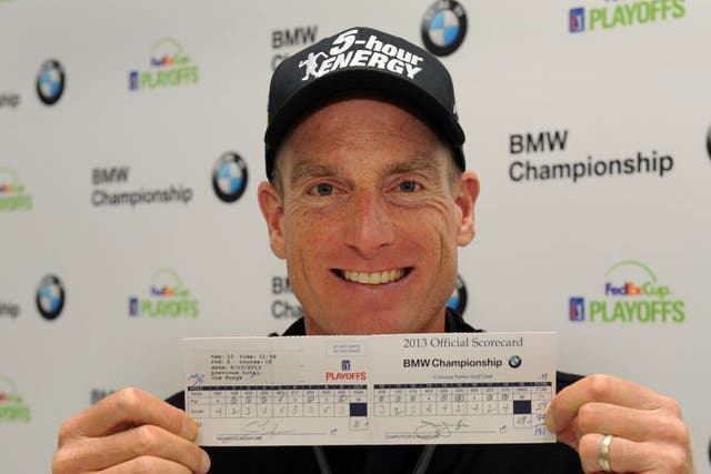 Jim Furyk poses with  his score card which recorded a "59"  during his second round of the BMW Championship at Conway Farms Golf Club