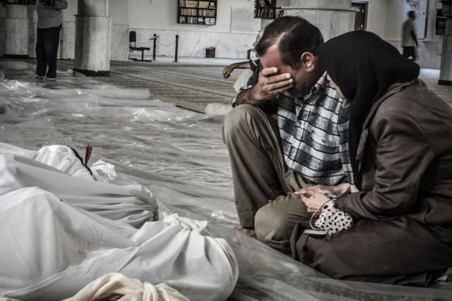Victims: Parents grieve for their child, gassed in Ghouta