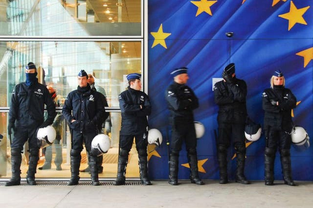 Police presence: Officers stand guard at the Europol conference at The Hague