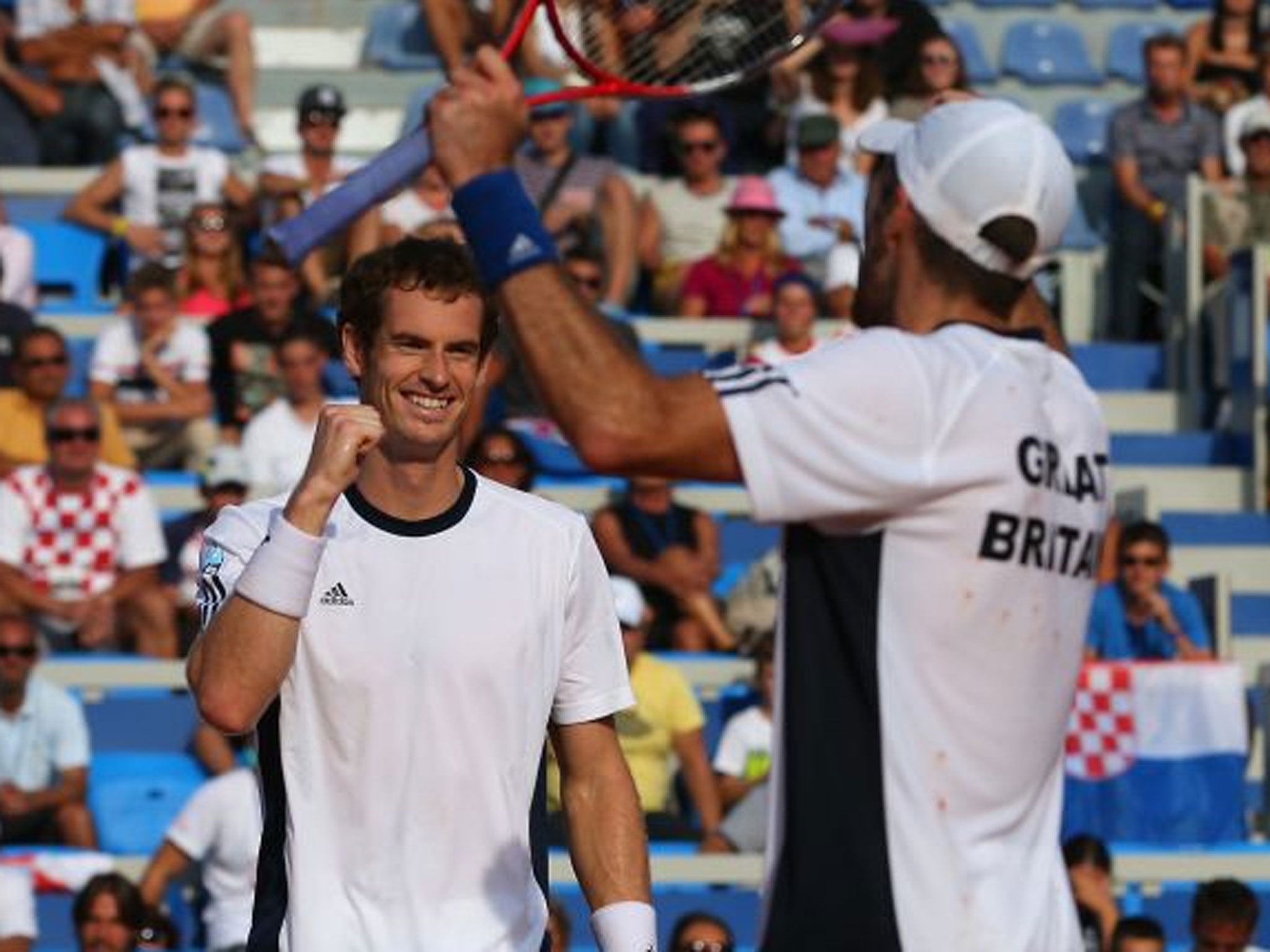 Double delight: Andy Murray (left) and Colin Fleming seal a four-set victory to give Britain a 2-1 lead over Croatia