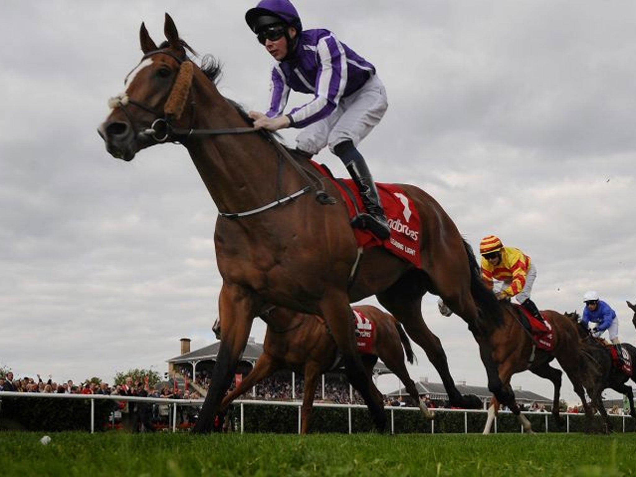 Leading the home: Leading Light, ridden by Joseph O’Brien for his father, Aidan, keeps the field comfortably at bay as he wins the St Leger at Doncaster