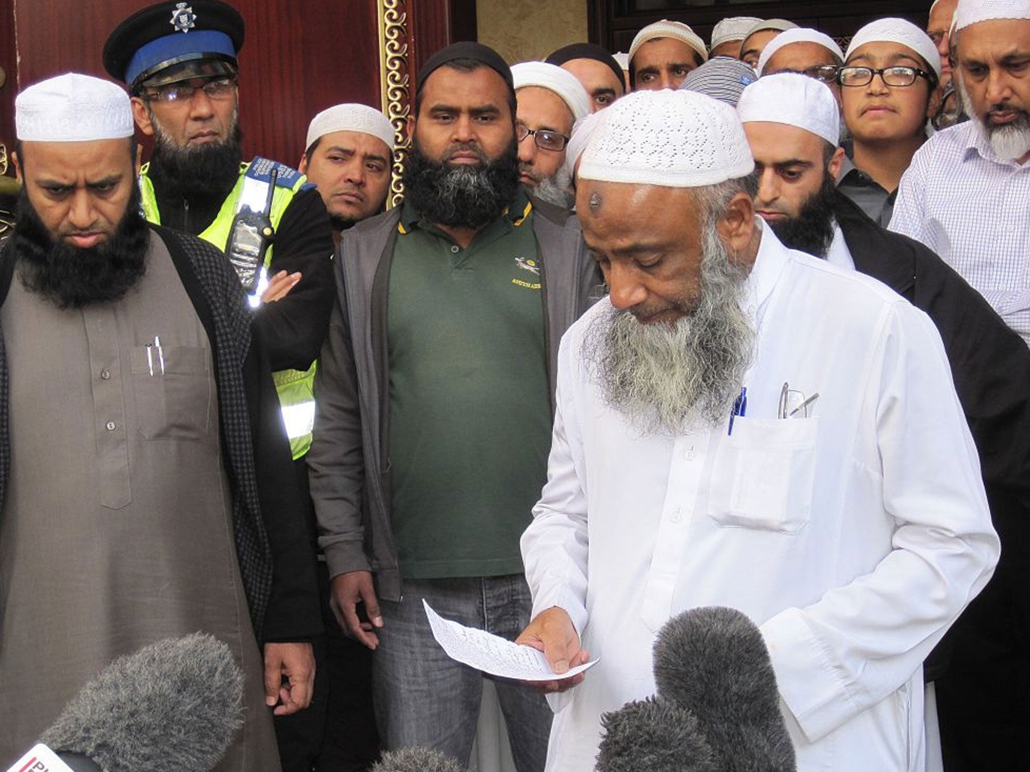 Muhammad Taufiq al-Sattar pays tribute to his wife and children who died in the fire