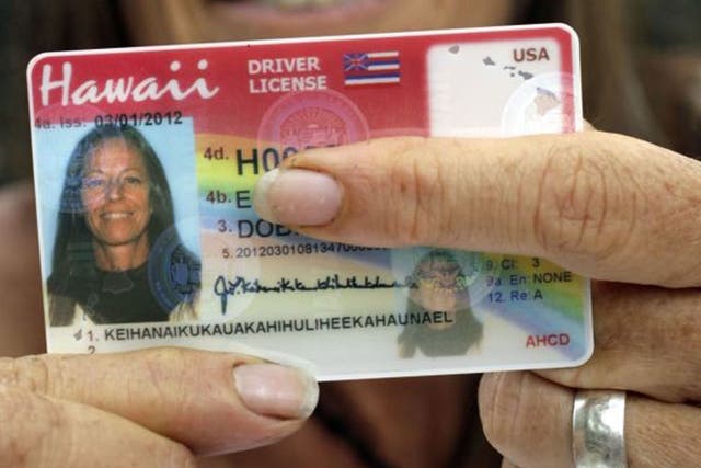 Janice Keihanaikukauakahihulihe'ekahaunaele holds her old licence, which only had space for her last name and missed off the final letter