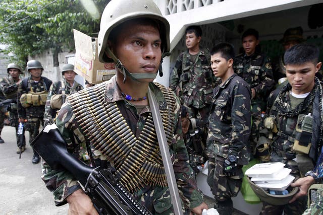 Government troopers in Zamboanga after the fight with Muslim rebels 