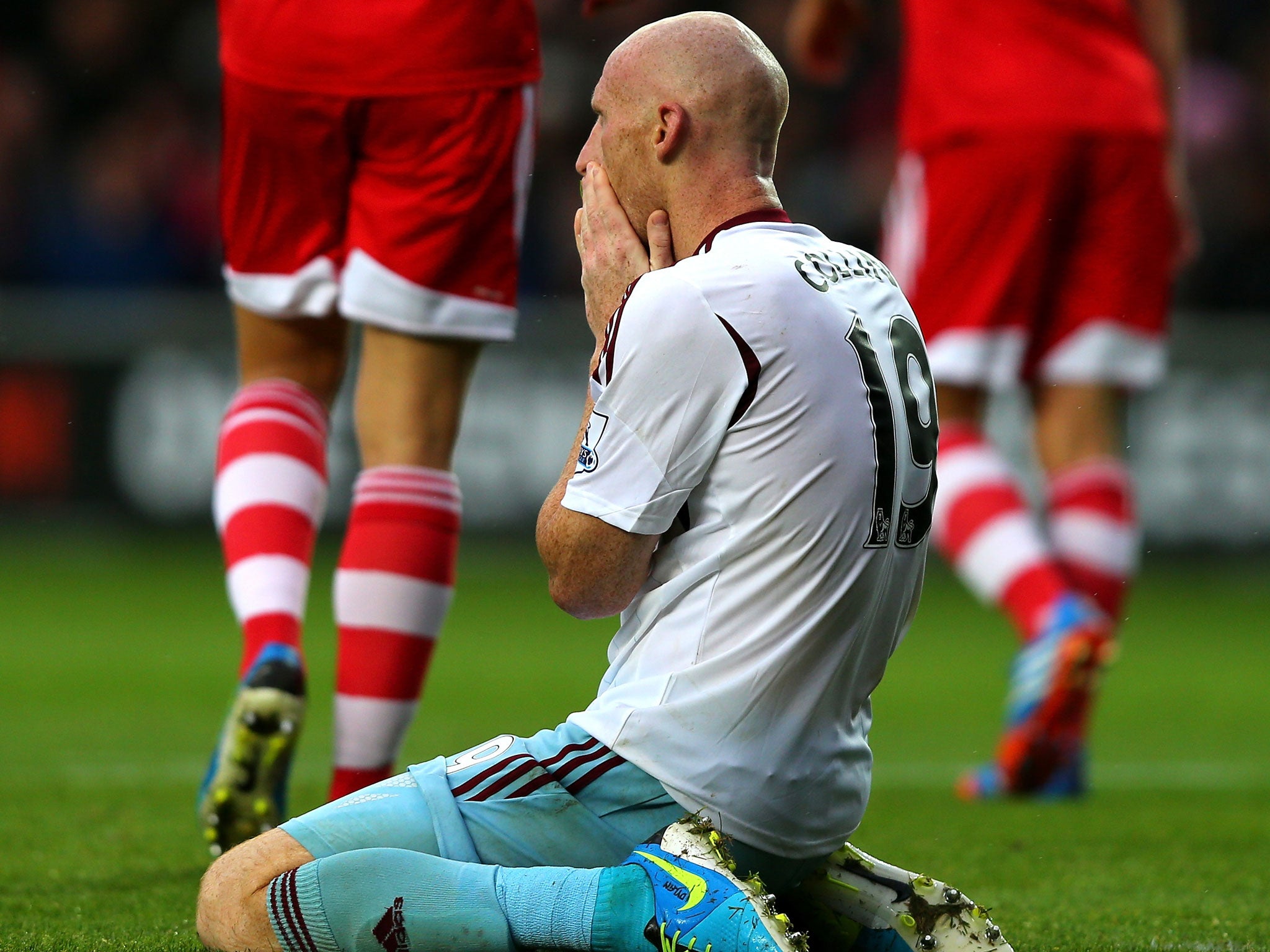 West Ham's James Collins reacts after his missed shot on goal