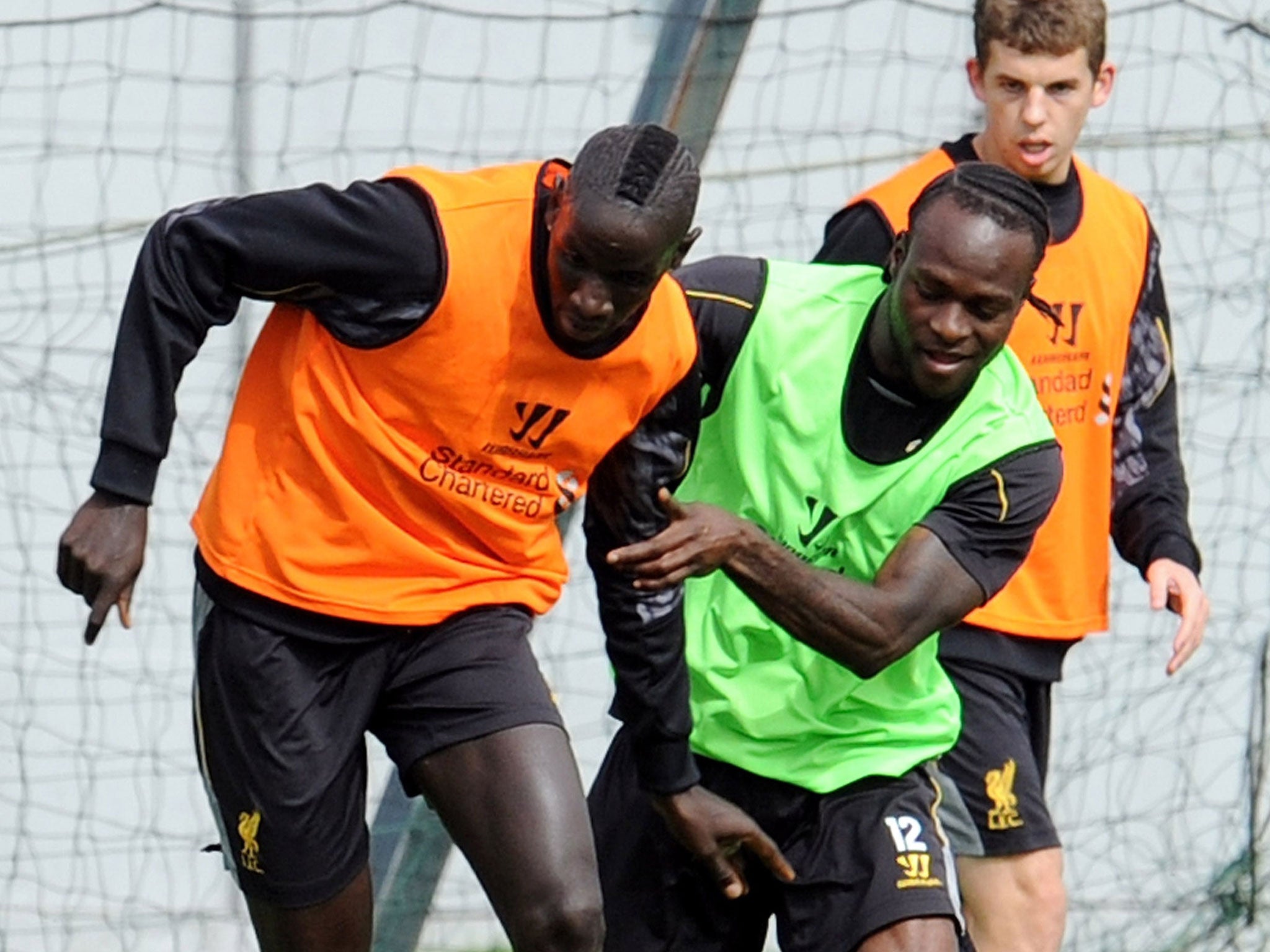 New Liverpool signing Mamadou Sakho, left, in training