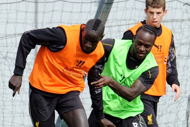 New Liverpool signing Mamadou Sakho, left, in training 