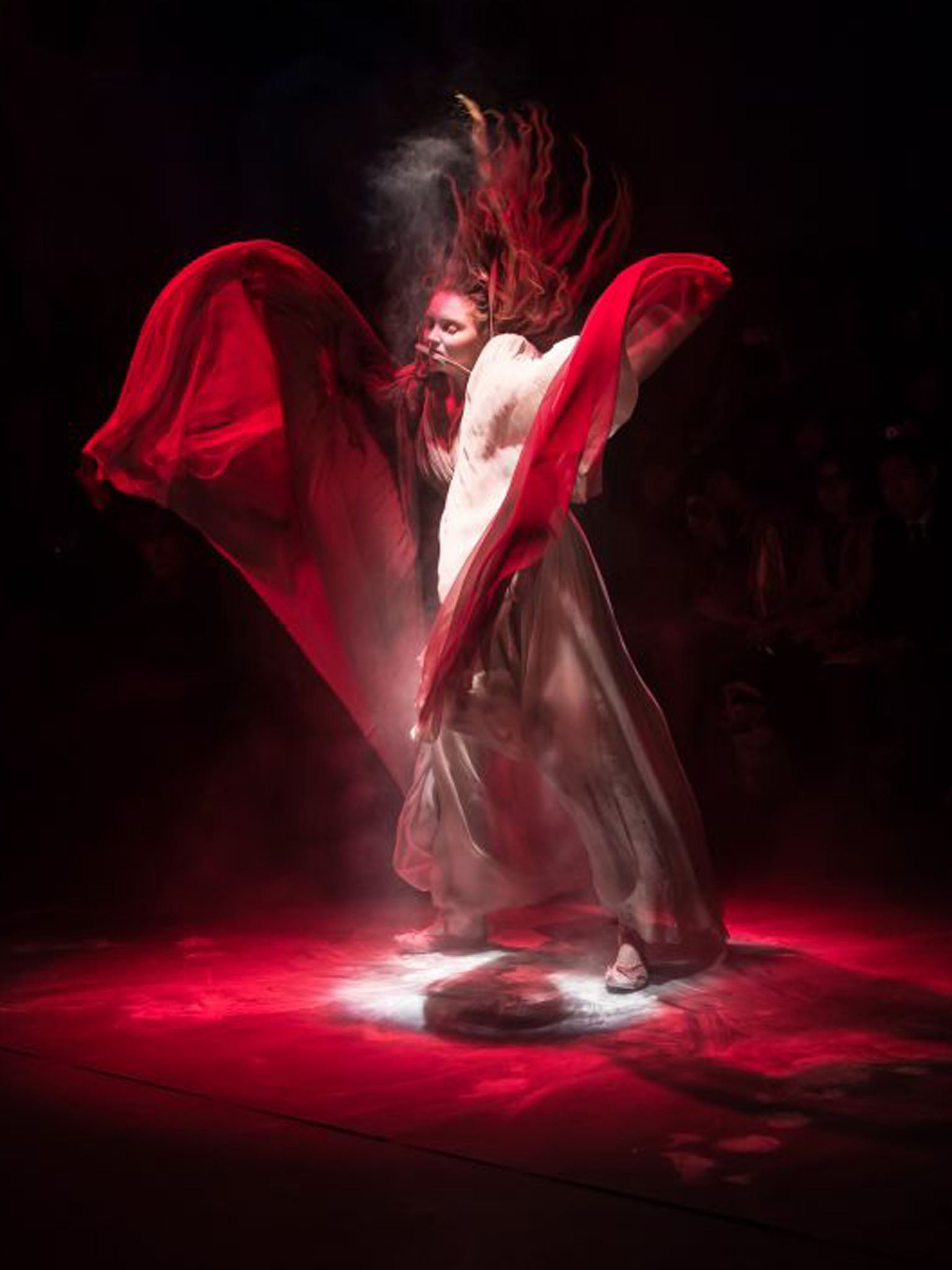 Model Lily Cole dances on stage prior to the Vivienne Westwood Red Label show