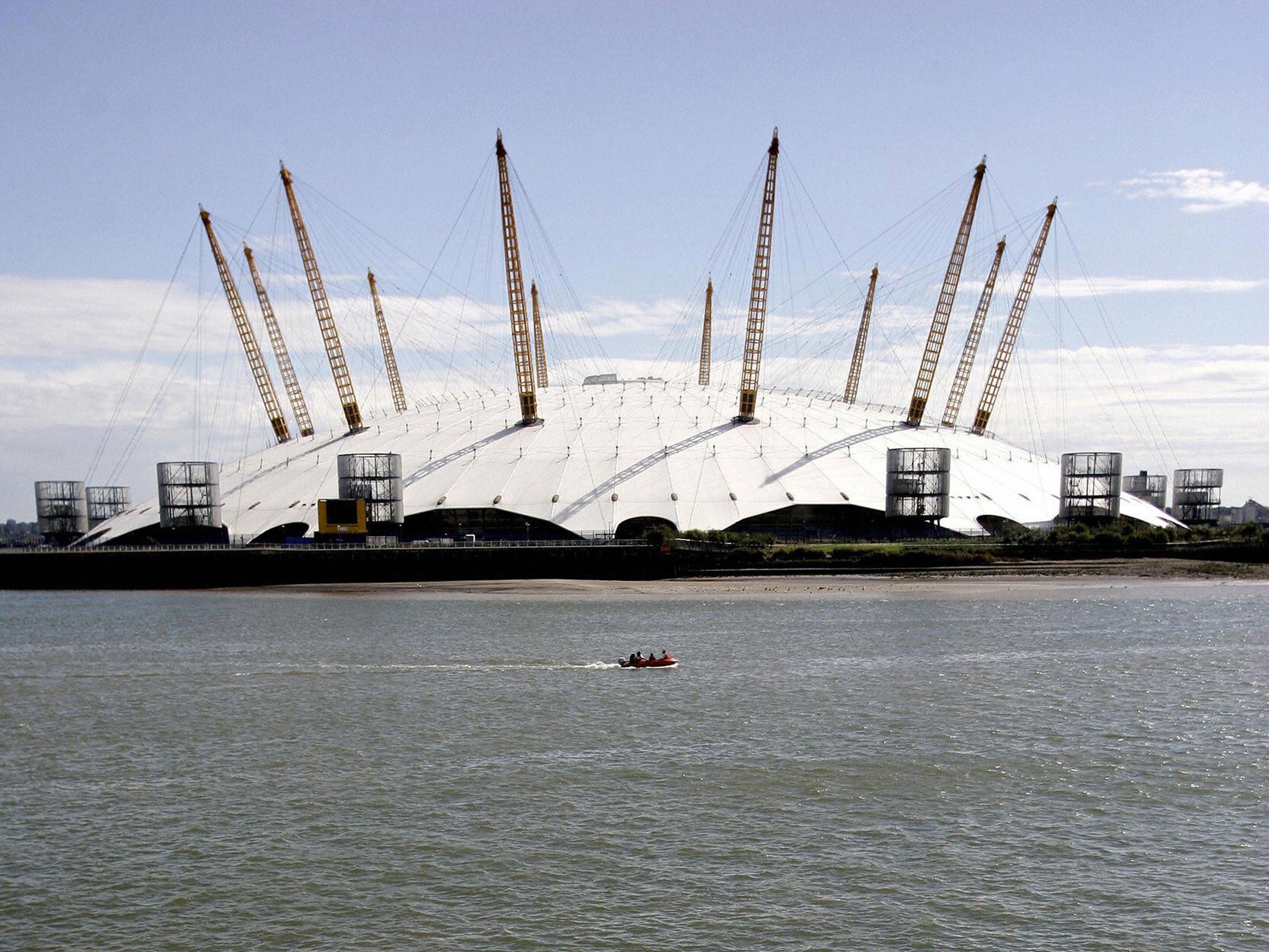 Millennium Dome, London: The Dome, now the O2 arena, opened in Greenwich in December 2000. Resembles a large circular marquee or giant 'Big Top'. Supported by 12 yellow towers – one for each month of the year. The largest structure of its kind in the wor