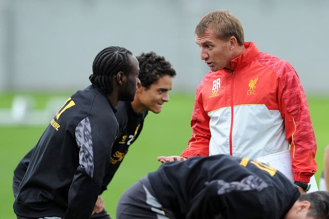 Brendan Rodgers talks with Victor Moses