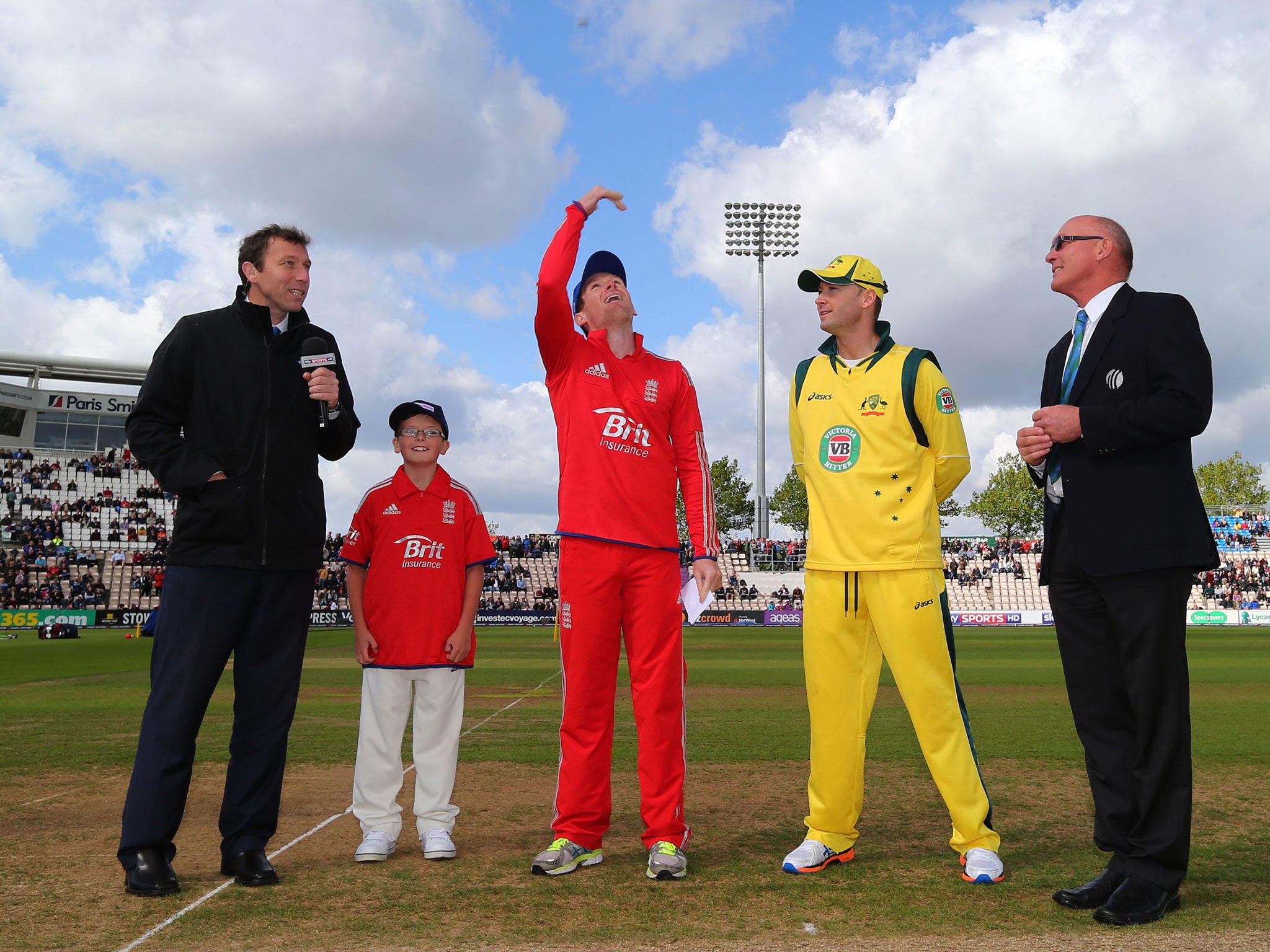 Eoin Morgan of England and Michael Clarke of Australia complete the toss