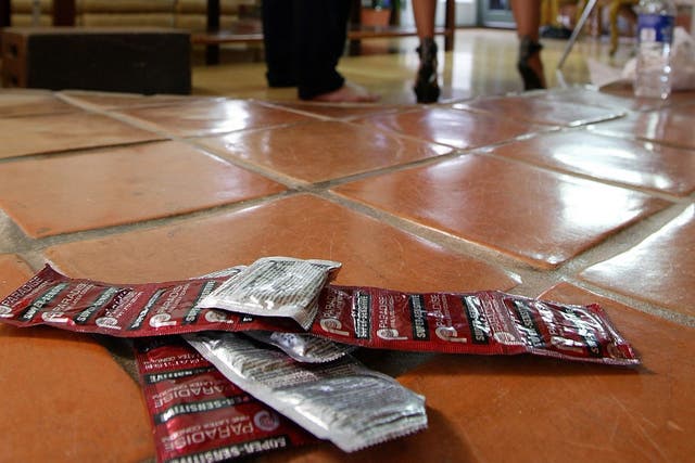 Ppackages of condoms readily available on the set as actors prepare to film a porn scene in California