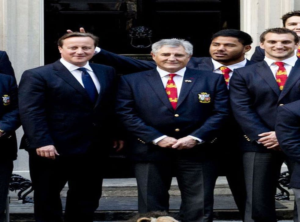 British and Irish Lions rugby star Manu Tuilagi sticking his fingers above Prime Minister David Cameron's head to give him "bunny ears" during a photo shoot at Downing Street to honour the Lions' victory over Australia.