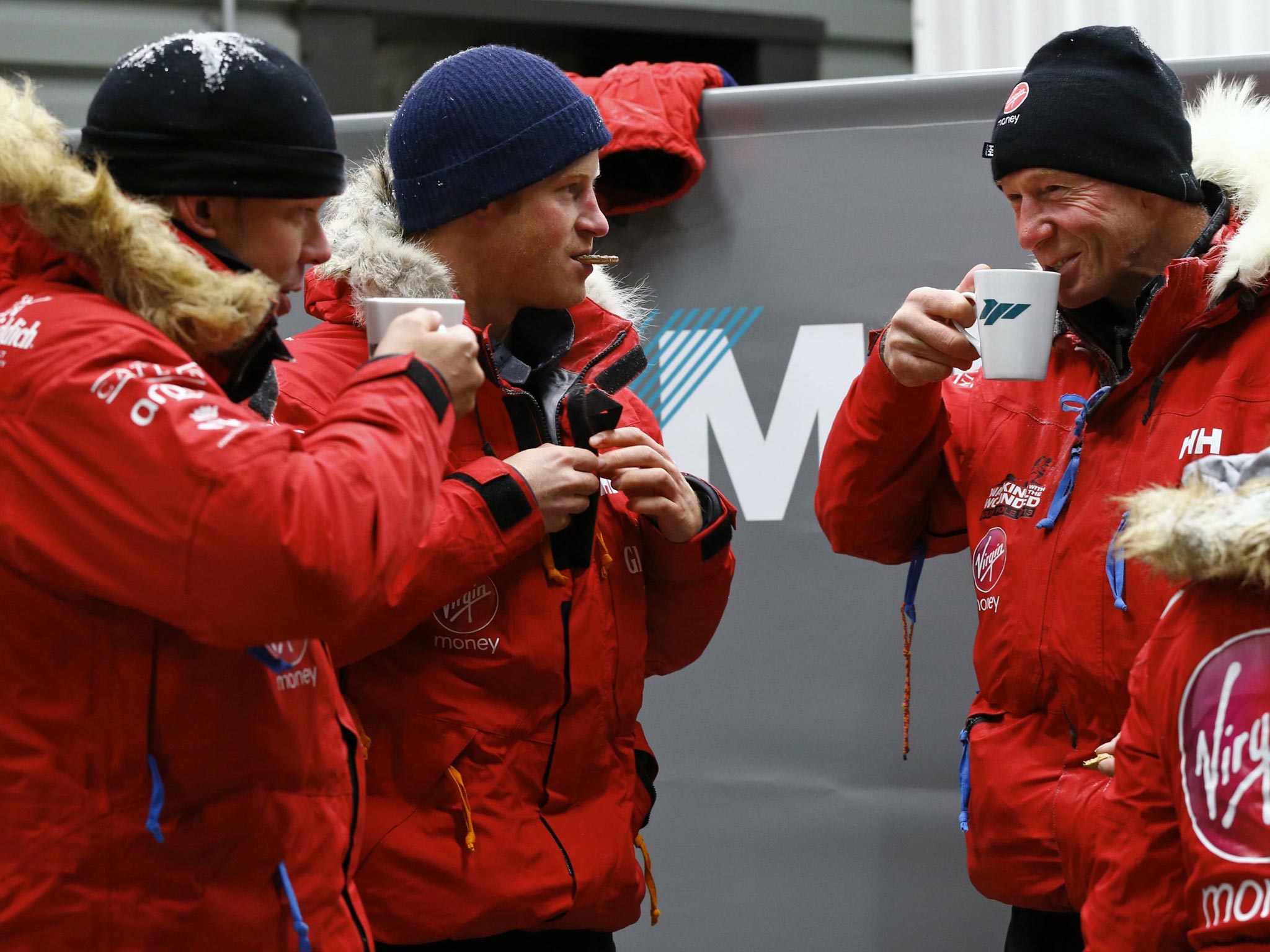 September 2013: Prince Harry, center, eats a biscuit after a cold chamber training exercise with the Walking with the Wounded South Pole Allied Challenge 2013 British team at Nuneaton, central England