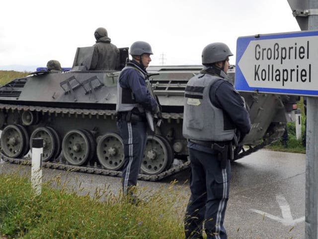 Austrian army soldiers in an armored vehicle arrive near the villages of Grosspriel and Kollapriel