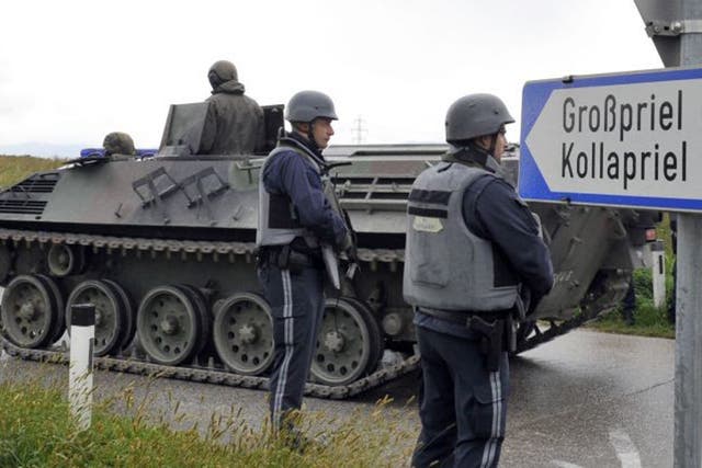 Austrian army soldiers in an armored vehicle arrive near the villages of Grosspriel and Kollapriel