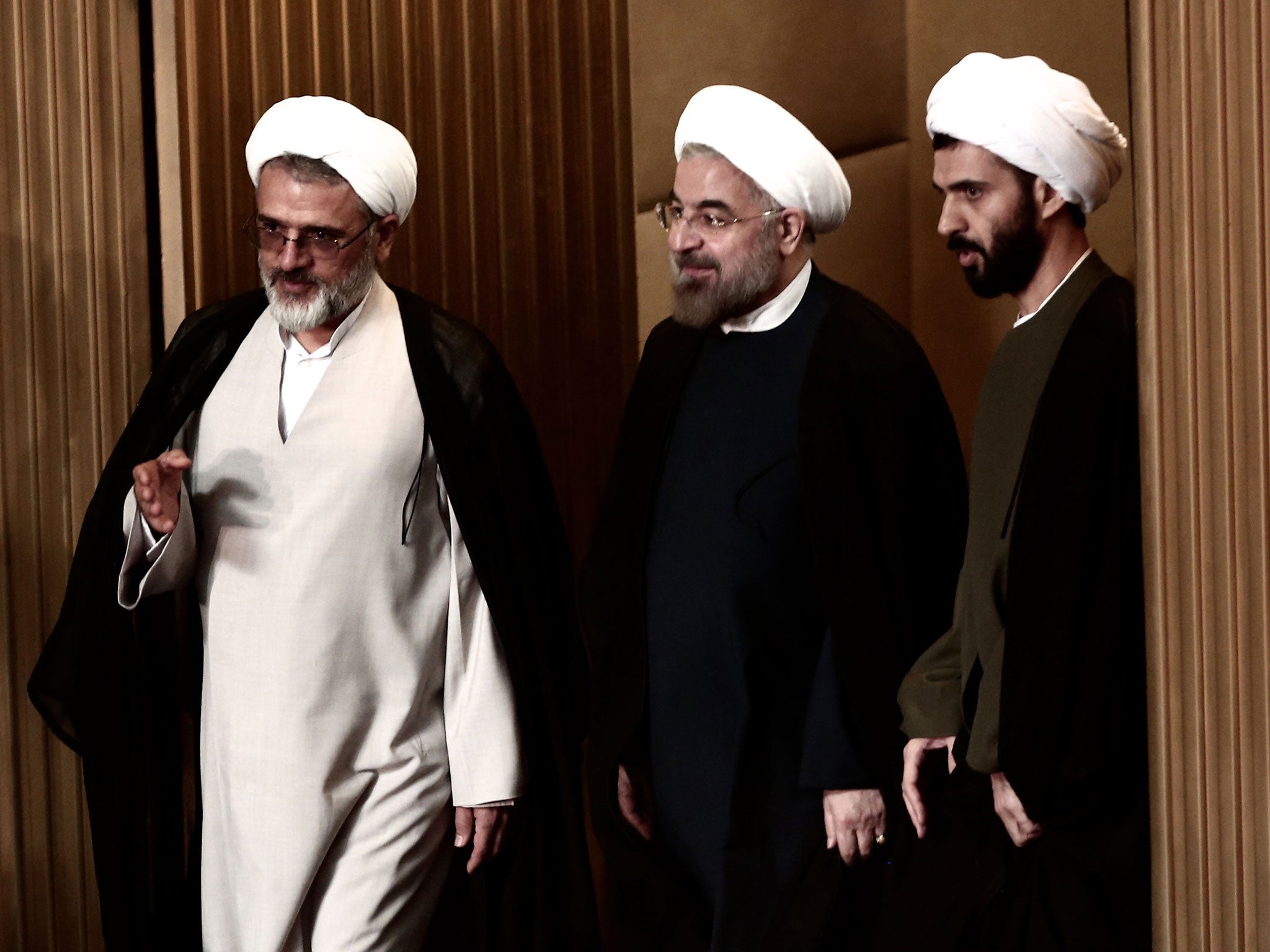 Iranian President Hassan Rouhani (C) attends a session of the Assembly of Experts in Tehran on September 3, 2013.