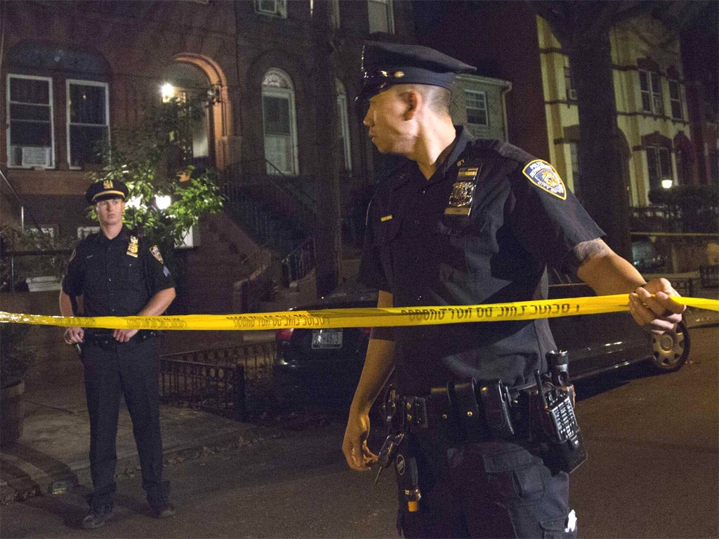 Outside the Brooklyn home of Cathleen Alexis, Aaron's mother