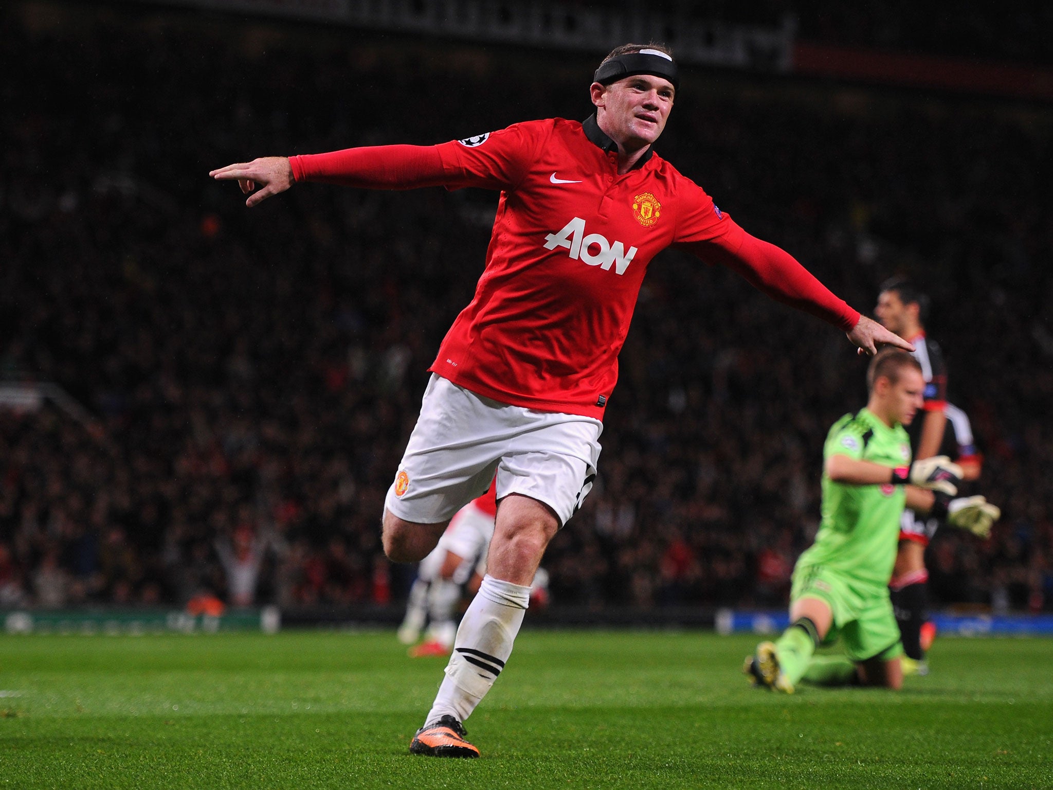 Wayne Rooney celebrates scoring against Bayer Leverkusen