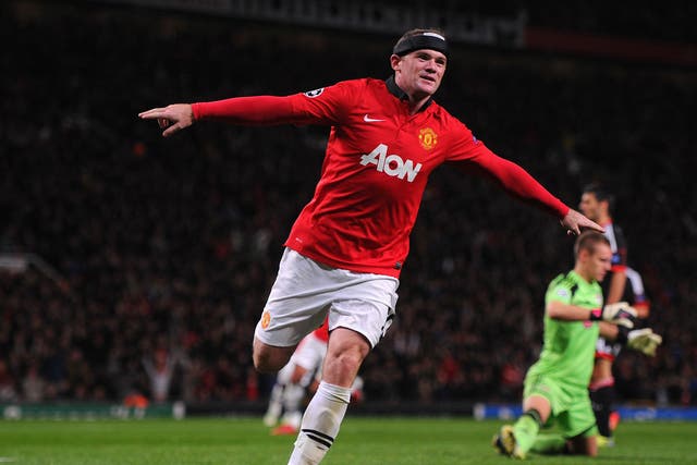 Wayne Rooney celebrates scoring against Bayer Leverkusen