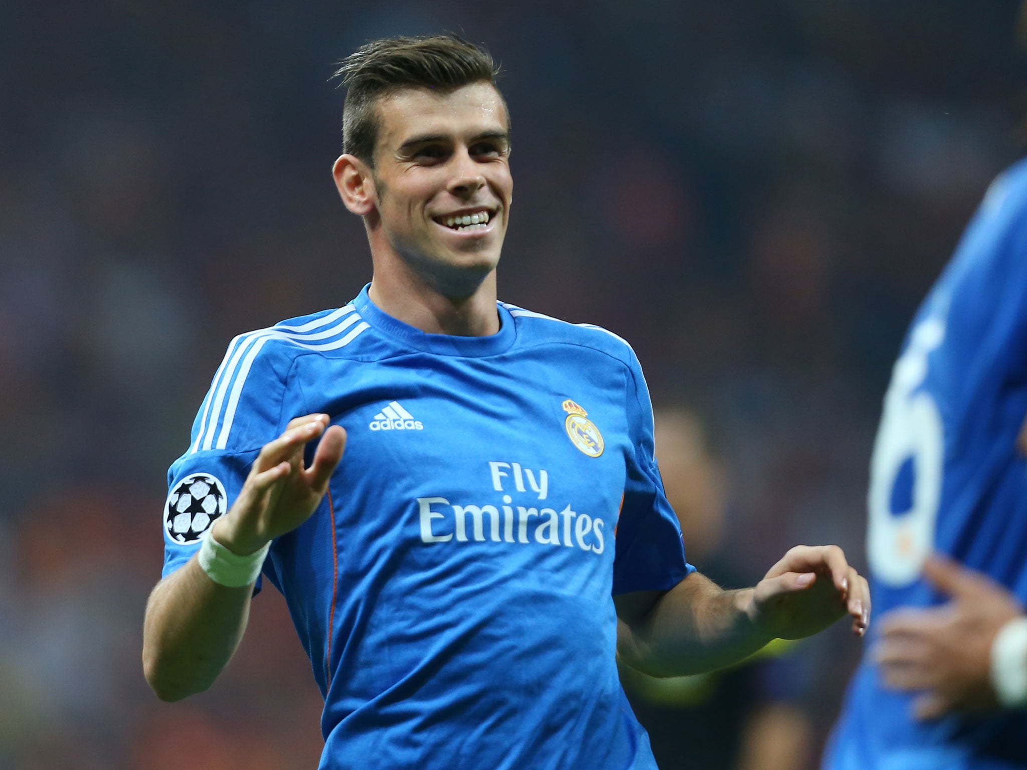 Gareth Bale celebrates after providing the assist for one of Cristiano Ronaldo's goals against Galatasaray