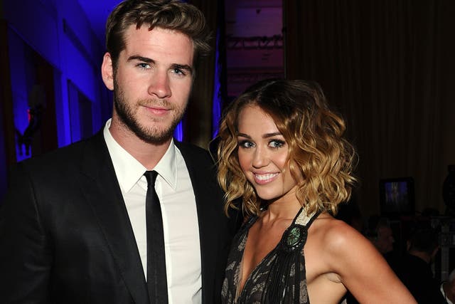 Happier times: Miley Cyrus and Chris Hemsworth who have called off their engagement