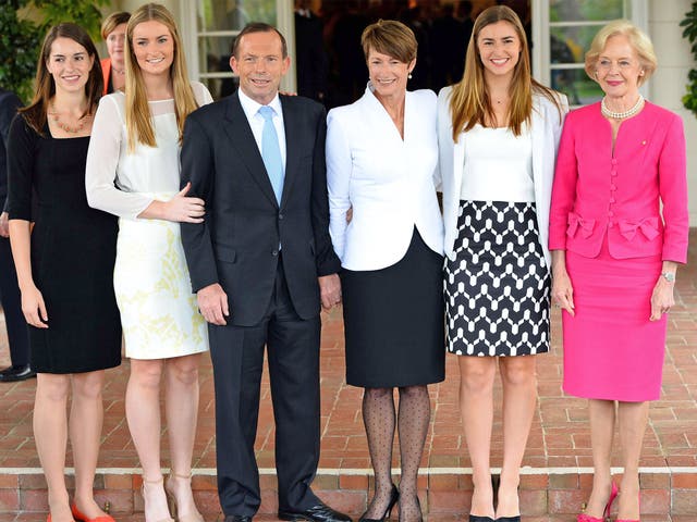 Tony Abbott with his wife Margie and daughters Frances, Louise and Bridget, and Governor-General Quentin Bryce (far right) after his swearing-in ceremony at Government House in Canberra