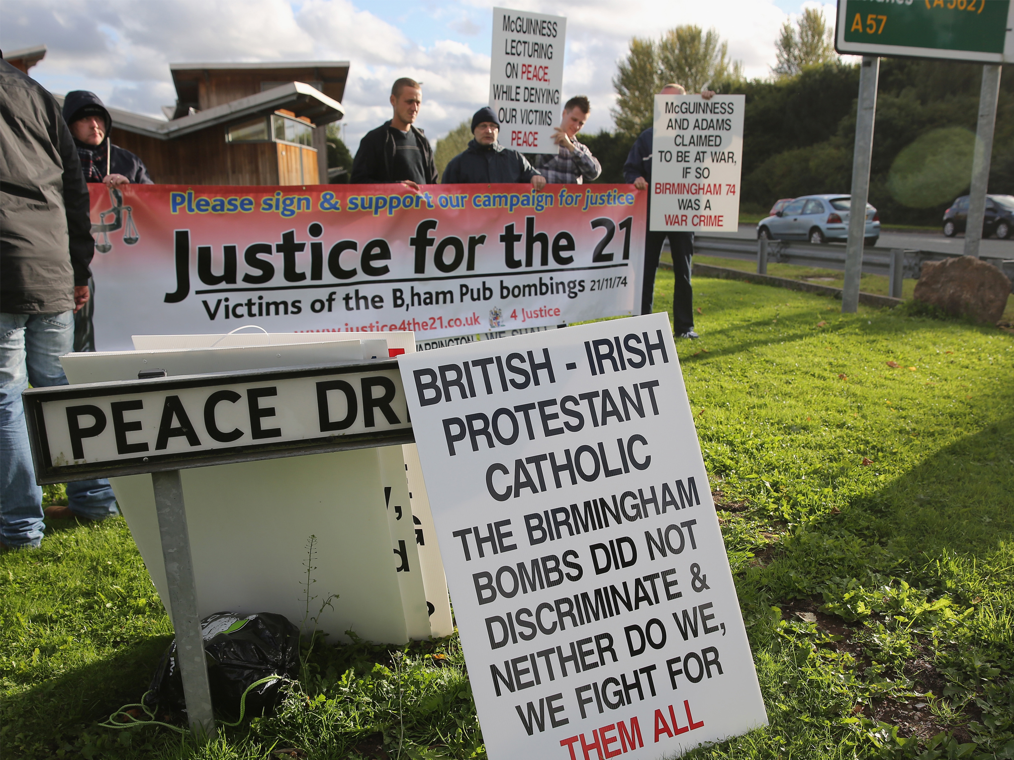 Protesters campaign outside the event (Getty)