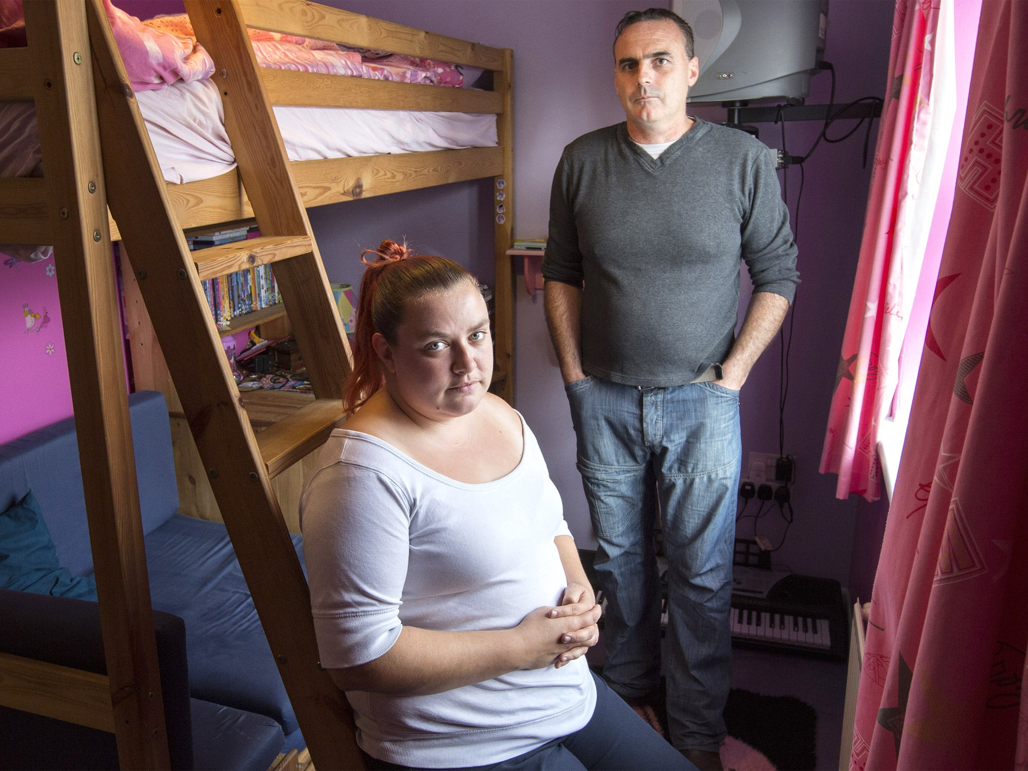 Toni Bloomfield (pictured with her partner Paul Bolton) pays £98 extra a month in bedroom tax