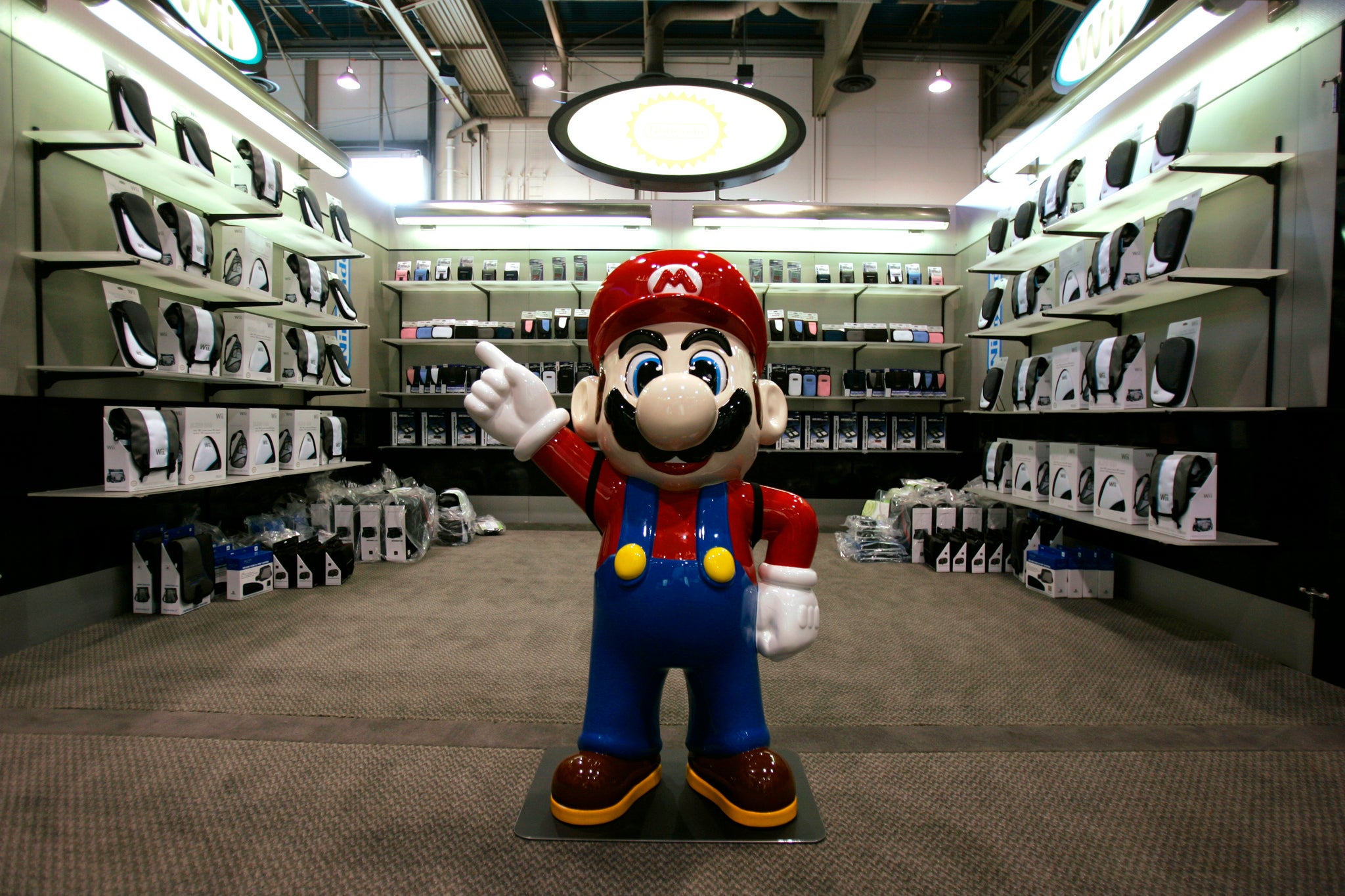 Mario waits for visitors at a booth being set up for 2007 International CES (Consumer Electronics Show) in Las Vegas, Nevada January 7, 2007.