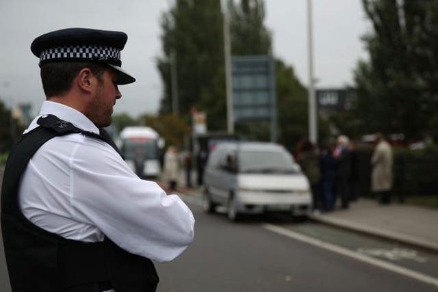 A policeman at the scene of Mark Duggan's shooting in Tottenham during a visit by the inquest jury