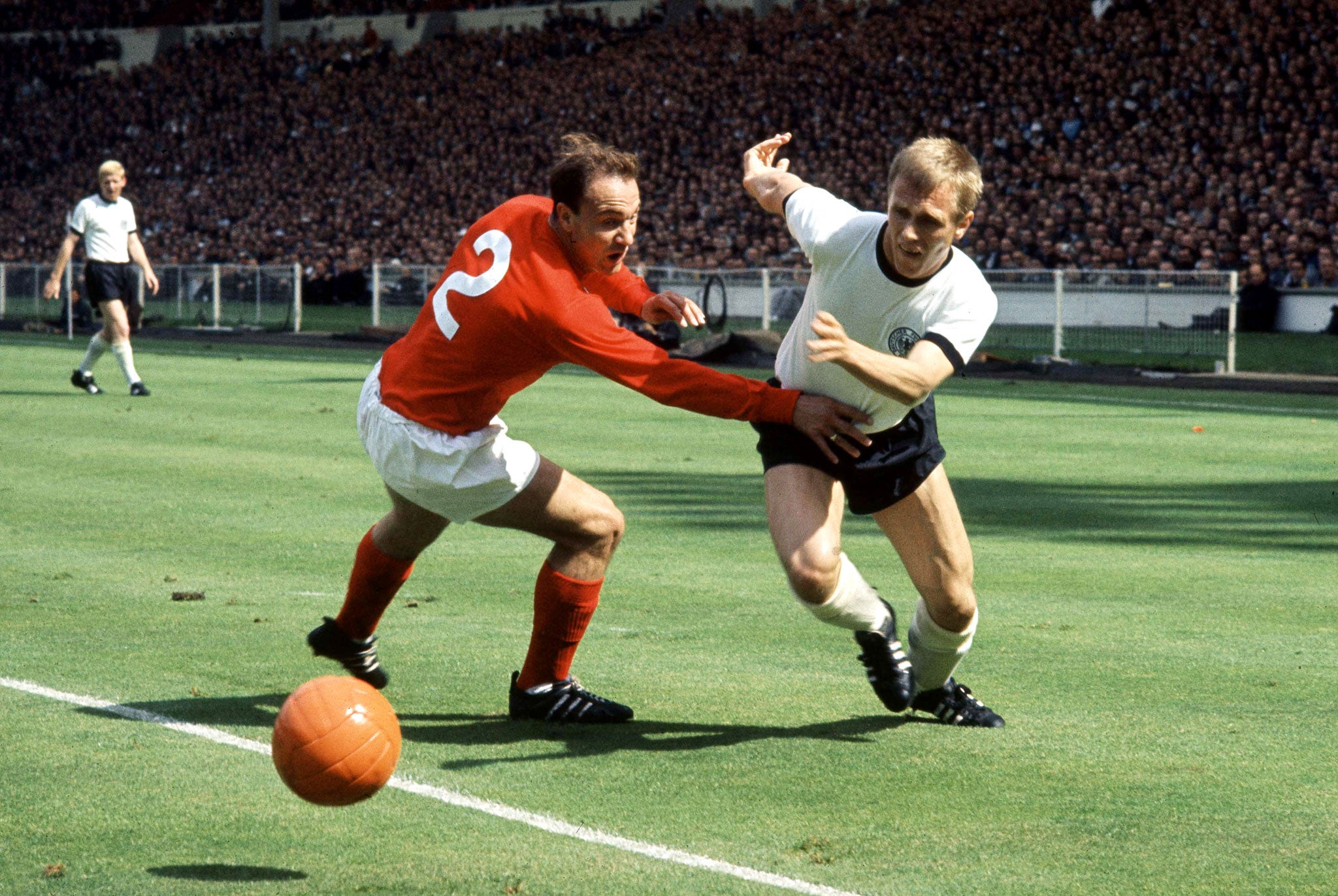 Glory days: Siegfried Held tries to break past George Cohen in the 1966 World Cup Final