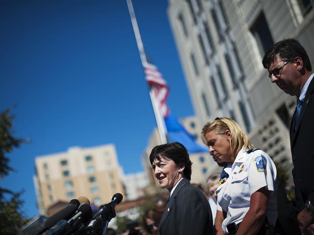 Valerie Parlave (L), Assistant Director in Charge, FBI Washington Field Office, speaks at a press conference on the Washington Navy Yard shootings on September 17, 2013 at the FBI Washington Field Office in Washington, DC. At second right is DC Police Chi