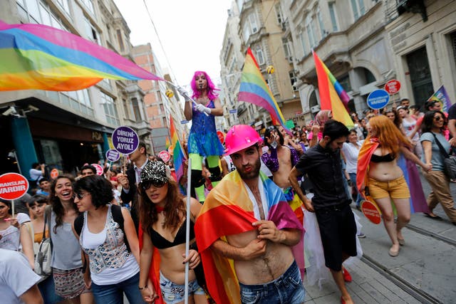 People march during a gay pride parade in central Istanbul June 30, 2013. Tens of thousands of anti-government protesters teamed up with a planned gay pride march in Istanbul.